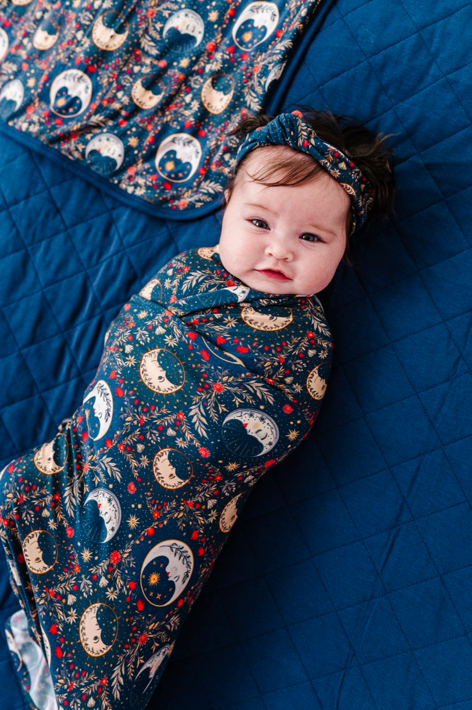 Baby in celestial moon swaddle